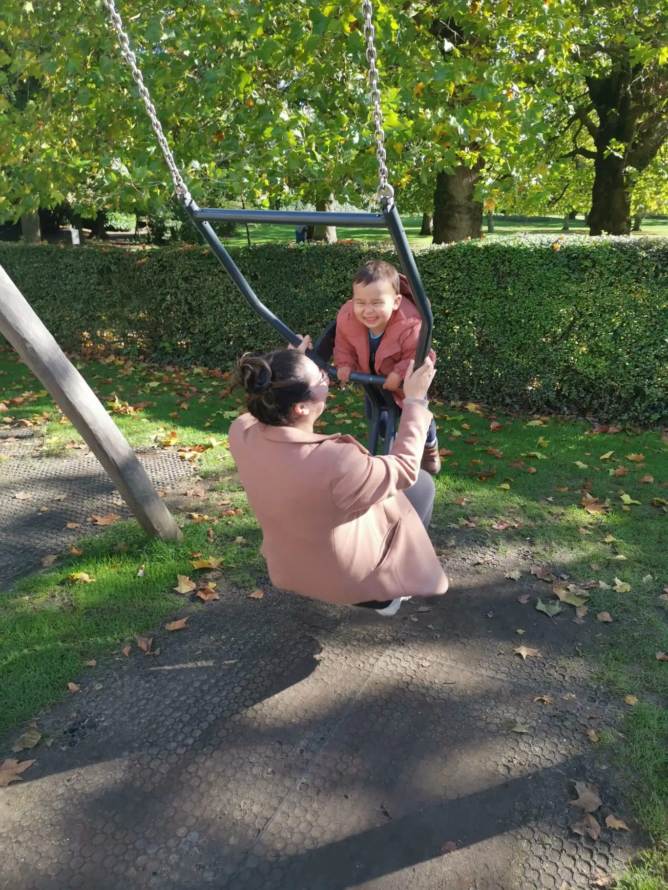 Parent and child on a swing